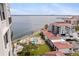 Scenic aerial view of the community featuring a pool, nearby waterfront, and well-kept landscaping, providing a luxurious living space at 6265 Sun Blvd # 1203, St Petersburg, FL 33715