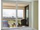Relaxing balcony overlooking city with chairs, table, and golf course at 6265 Sun Blvd # 1203, St Petersburg, FL 33715