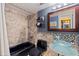 Bathroom featuring bowl sink, and black tile-surround bathtub and shower at 6265 Sun Blvd # 1203, St Petersburg, FL 33715