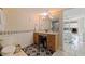 Well lit bathroom featuring ample vanity storage, a large mirror, and easy access to the bedroom at 6265 Sun Blvd # 1203, St Petersburg, FL 33715