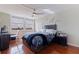 Inviting bedroom featuring hardwood floors and expansive windows overlooking the outside landscape at 6265 Sun Blvd # 1203, St Petersburg, FL 33715