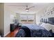 Spacious bedroom with wooden floors, city views, ceiling fan, and modern furniture at 6265 Sun Blvd # 1203, St Petersburg, FL 33715