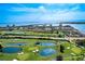 Scenic aerial of lush golf course community with multiple ponds and stunning waterfront views at 6265 Sun Blvd # 1203, St Petersburg, FL 33715