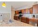 Modern kitchen features stainless steel appliances, mosaic backsplash, and granite countertops at 6265 Sun Blvd # 1203, St Petersburg, FL 33715