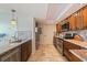 Well lit kitchen with stainless appliances, stone floors and granite countertops at 6265 Sun Blvd # 1203, St Petersburg, FL 33715