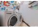 Laundry room featuring a side-by-side washer and dryer and wire shelving at 6265 Sun Blvd # 1203, St Petersburg, FL 33715