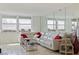 Bright living room with modern decor, tile floors, and a view of the city at 6265 Sun Blvd # 1203, St Petersburg, FL 33715