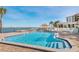 Inviting waterfront pool overlooks water and the open sky beyond at 6265 Sun Blvd # 1203, St Petersburg, FL 33715