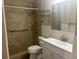 Bathroom with walk-in shower, grab bars, and single sink vanity at 6520 Thicket Trl, New Port Richey, FL 34653