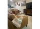 Cozy living room with stylish decor, complemented by hardwood floors and abundant natural light at 6520 Thicket Trl, New Port Richey, FL 34653