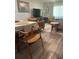 Dining area featuring hardwood floors and a seamless transition into the modern, airy living room at 6520 Thicket Trl, New Port Richey, FL 34653