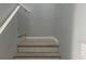 Stairway with light hardwood steps at 6520 Thicket Trl, New Port Richey, FL 34653