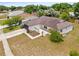 An elevated view showcasing the home's layout, landscaping, and neighborhood surroundings on a sunny day at 6826 Rosemary Dr, Tampa, FL 33625