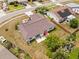 Aerial view of a single Gathering home with a backyard patio and mature landscaping in a quiet neighborhood at 6826 Rosemary Dr, Tampa, FL 33625