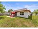 Well-maintained backyard with a patio, outdoor seating, and grassy area, perfect for outdoor relaxation and entertainment at 6826 Rosemary Dr, Tampa, FL 33625
