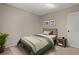 This is a bedroom with neutral walls, one window, and green bedding at 6826 Rosemary Dr, Tampa, FL 33625