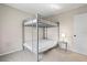Bedroom featuring bunkbeds, carpet, and a bedside table with a lamp at 6826 Rosemary Dr, Tampa, FL 33625