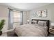 Cozy bedroom featuring neutral tones, a comfortable bed, and stylish decor, creating a relaxing ambiance at 6826 Rosemary Dr, Tampa, FL 33625