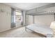 This is a bedroom with neutral walls and a bunkbed, with curtains on the window at 6826 Rosemary Dr, Tampa, FL 33625