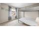 This is a bedroom with neutral walls and a bunkbed, with curtains on the window at 6826 Rosemary Dr, Tampa, FL 33625