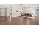 Open concept living and dining area with access to the kitchen and wood-look flooring at 6826 Rosemary Dr, Tampa, FL 33625