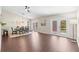 Spacious living room and dining area with a modern ceiling fan and access to the outdoor patio at 6826 Rosemary Dr, Tampa, FL 33625