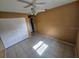 Comfortable bedroom featuring neutral colors, a ceiling fan, and a spacious closet at 7001 86Th N Ave, Pinellas Park, FL 33782