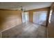 Spacious bedroom with tile floors, ceiling fan, and plenty of closet space at 7001 86Th N Ave, Pinellas Park, FL 33782