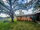 This home has a beautiful lawn with mature trees, landscaping, and a sprinkler system at 7001 86Th N Ave, Pinellas Park, FL 33782