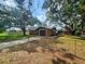 Charming home with mature trees, a driveway, and a fenced front yard at 7001 86Th N Ave, Pinellas Park, FL 33782