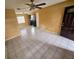 Spacious living room provides an open view to the kitchen area, and boasts tiled floors at 7001 86Th N Ave, Pinellas Park, FL 33782