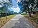 Street view with a fire hydrant, and a glimpse of the adjacent canal at 7001 86Th N Ave, Pinellas Park, FL 33782