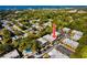 Aerial view showcasing the condo community's lush surroundings and proximity to the water at 704 Lyndhurst St # 624, Dunedin, FL 34698