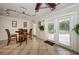Bright dining space with a table, chairs, and access to the outdoors through glass doors at 704 Lyndhurst St # 624, Dunedin, FL 34698