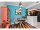 Charming dining area featuring a unique pendant light fixture and vintage-inspired decor at 704 Lyndhurst St # 624, Dunedin, FL 34698
