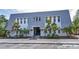 Charming exterior view of the building showcasing unique architecture and manicured landscaping at 704 Lyndhurst St # 624, Dunedin, FL 34698