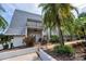 Charming home featuring lovely landscaping, inviting entrance, and private balcony at 704 Lyndhurst St # 624, Dunedin, FL 34698