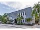 A spacious condo building showing great landscaping and stylish architecture at 704 Lyndhurst St # 624, Dunedin, FL 34698