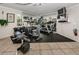 Well-equipped gym featuring treadmills, elliptical, weights, and a mirrored wall at 704 Lyndhurst St # 624, Dunedin, FL 34698