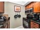 Kitchen with stainless appliances, granite countertops, wood cabinets and bright lighting at 704 Lyndhurst St # 624, Dunedin, FL 34698