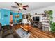 Comfortable living room featuring hardwood floors, and open access to the kitchen at 704 Lyndhurst St # 624, Dunedin, FL 34698