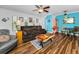 Relaxing living room area with natural light and ample seating at 704 Lyndhurst St # 624, Dunedin, FL 34698