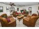 Inviting lounge area featuring comfortable wicker chairs, a table, and decorative accents at 704 Lyndhurst St # 624, Dunedin, FL 34698