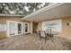 Charming outdoor lounge area with table, chairs, and view of the Victoria Palms logo at 704 Lyndhurst St # 624, Dunedin, FL 34698