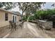 Outdoor patio with dining and bar seating areas perfect for entertaining with lush surroundings at 704 Lyndhurst St # 624, Dunedin, FL 34698