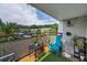 Relaxing balcony with a table, chair, and potted plants, perfect for outdoor enjoyment at 704 Lyndhurst St # 624, Dunedin, FL 34698