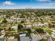 Aerial view of neighborhood with mature trees, manicured lawns, and the home highlighted with a marker at 743 43Rd Ne Ave, St Petersburg, FL 33703