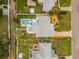 Aerial view of a home with a backyard featuring a pool, manicured lawn, and patio at 743 43Rd Ne Ave, St Petersburg, FL 33703