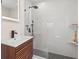 Sleek bathroom featuring a modern vanity, a minimalist sink, and a glass-enclosed shower with black hardware at 743 43Rd Ne Ave, St Petersburg, FL 33703