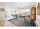 Open concept dining area flowing into the kitchen with hardwood floors and abundant light at 743 43Rd Ne Ave, St Petersburg, FL 33703